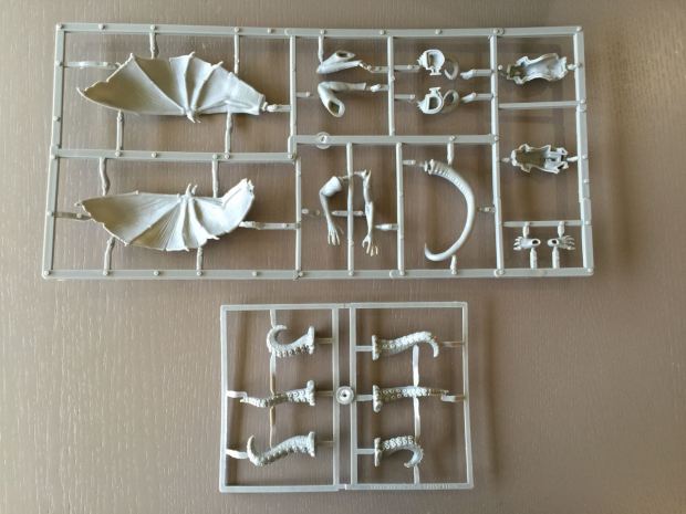 At the top is the gigantic Harbinger miniature, below are some tentacles.