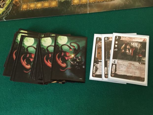 I put my new Syndicate criminals deck in the sleeves with the picture from the Arkham Horror box