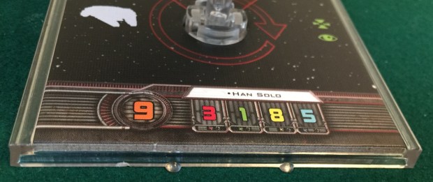 The pilot skill is shown by the big orange number. Han Solo has the maximum possible, a 9.